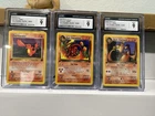1sr Edition 2000 Team Rocket Charmander,Charmeleon, Charizard CGC 9