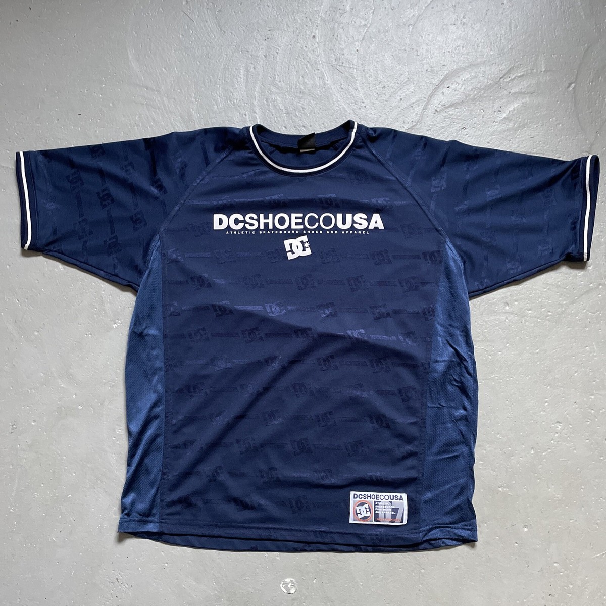 Vintage 1990s DC Shoes Skateboarding T-Shirt Mesh Jersey Vintage 1990s DC Shoes Skateboarding T-Shirt Mesh Jersey