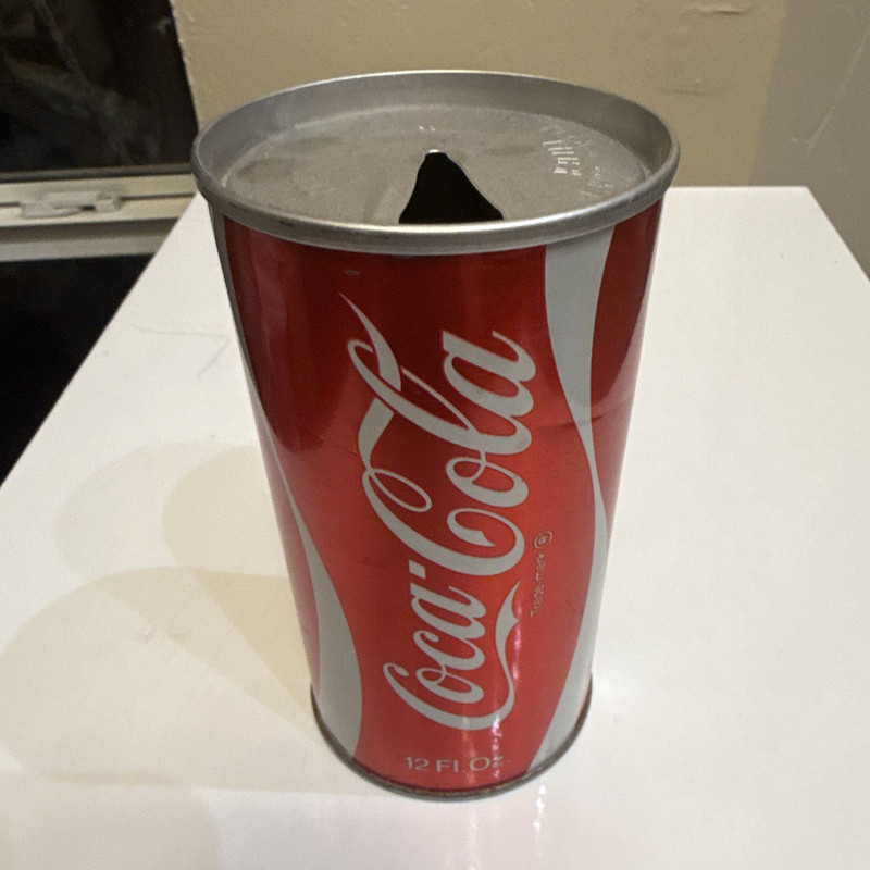Vintage 1970s steel Coca-Cola can featuring a classic pull-tab opening