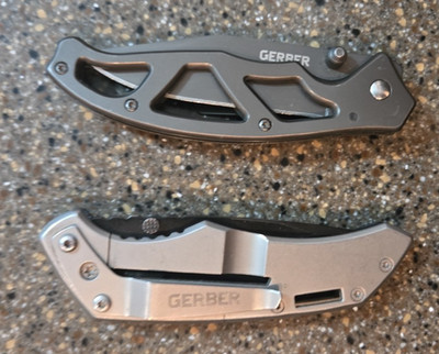 Two Gerber Knifes model 4040717A1 and a paraframe with no exact model no. on it