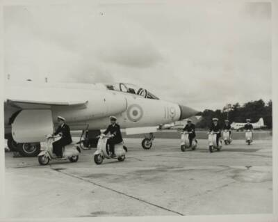 Fleet Air Arm pilots riding Pina midget motor cycles specially con- Old Photo