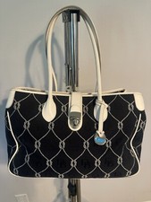 dooney  bourke Black Canvas bag with white leather straps.