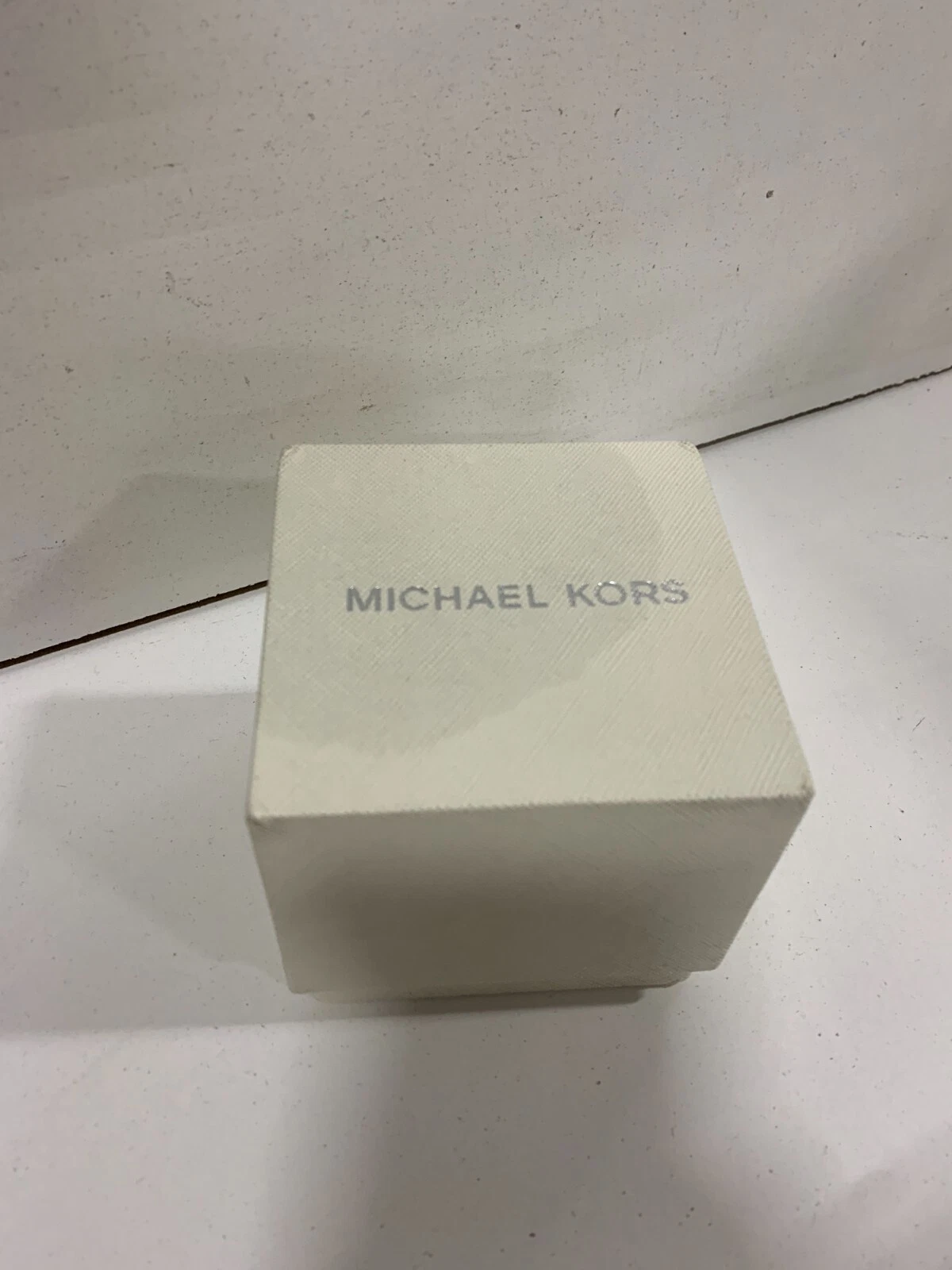 Michael Kors MK 7119. Cinturino oro rosa e quadrante rosa.