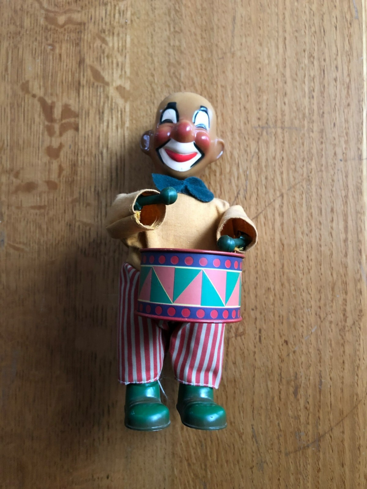 Working wind-up clown face working  plastic drummer boy toy