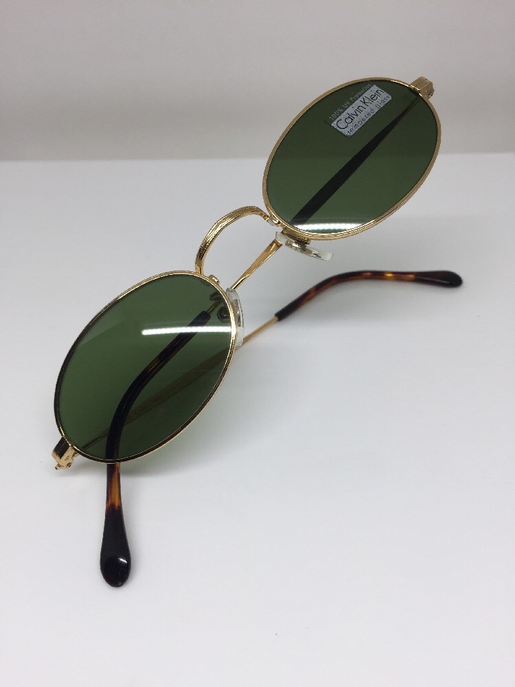 Calvin Klein Small Oval Sunglasses Calvin Klein 1010 Oval Silver Metal Sunglasses W Black Cello  main image 3