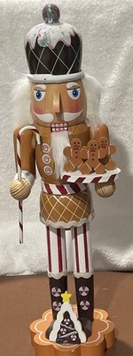 Gingerbread nutcracker With Cookies In Hand And Candy Cane