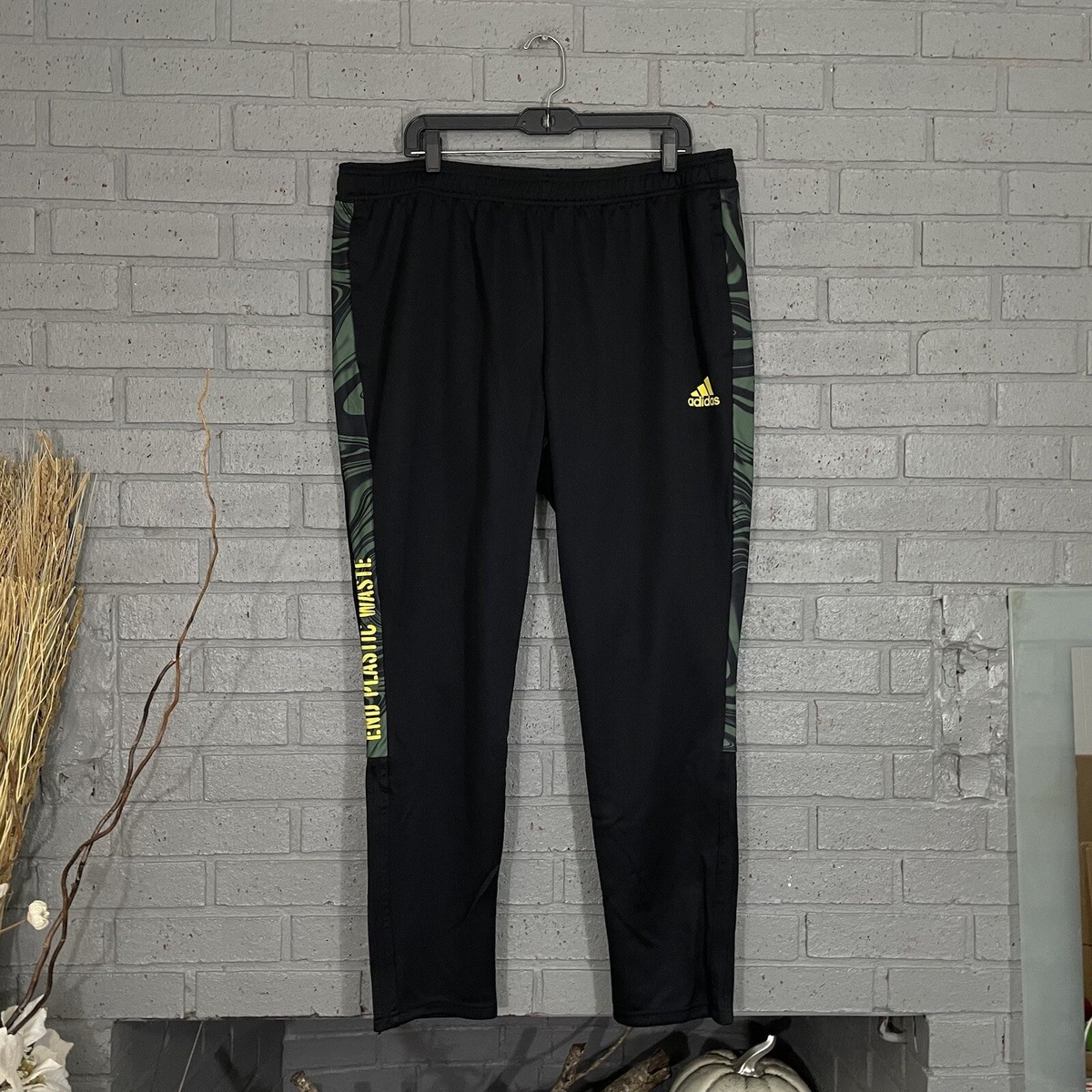 black and gold tiro pants