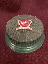 Vintage "VOGUE" brand 4 metal flower frog/holder...never used...still wrapped