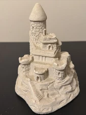 This is a Mr. Sandman white sand castle figurine made from real sand.