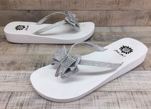 yellow box glitter flip flops