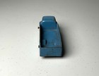 Blue vintage Tootsietoy #234 box truck with worn metal parts and visible “Made in U.S.A.” text on top.