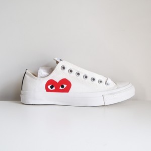 white sneakers with red heart