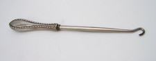 ANTIQUE STERLING HANDLE BUTTON HOOK DECORATION ON EDGE