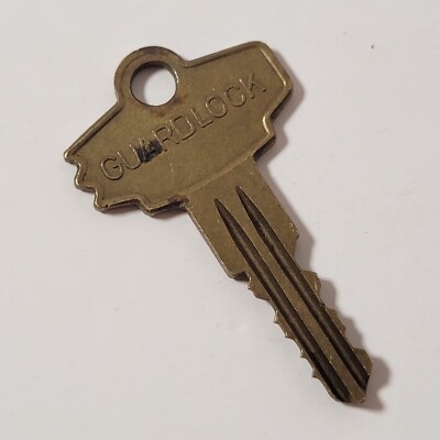 Vintage Unique Shape GUARDLOCK brass key Approx 1 7/8'' Long 