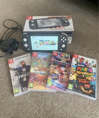 Nintendo Switch Lite Konsole Konvolut 4 Spiele, mit Box und Original Ladegerät 