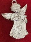 Silver angel.  Pendant, ornament