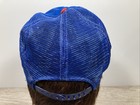 Blue US-made wide-stripe trucker hat with red cap, silver buckle, and mesh fabric on a mannequin head.