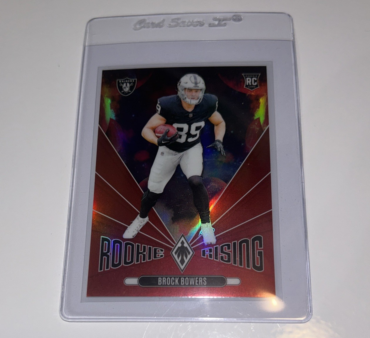 2024 Panini Phoenix Rookie Rising Red 48 Brock Bowers Rookie 61/99