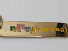 "Party Animal" Metallic Gold Toned Keychain