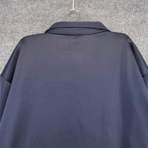 Dark blue men's full zip jacket with notch lapel, hanging on white hanger against light gray textured background.