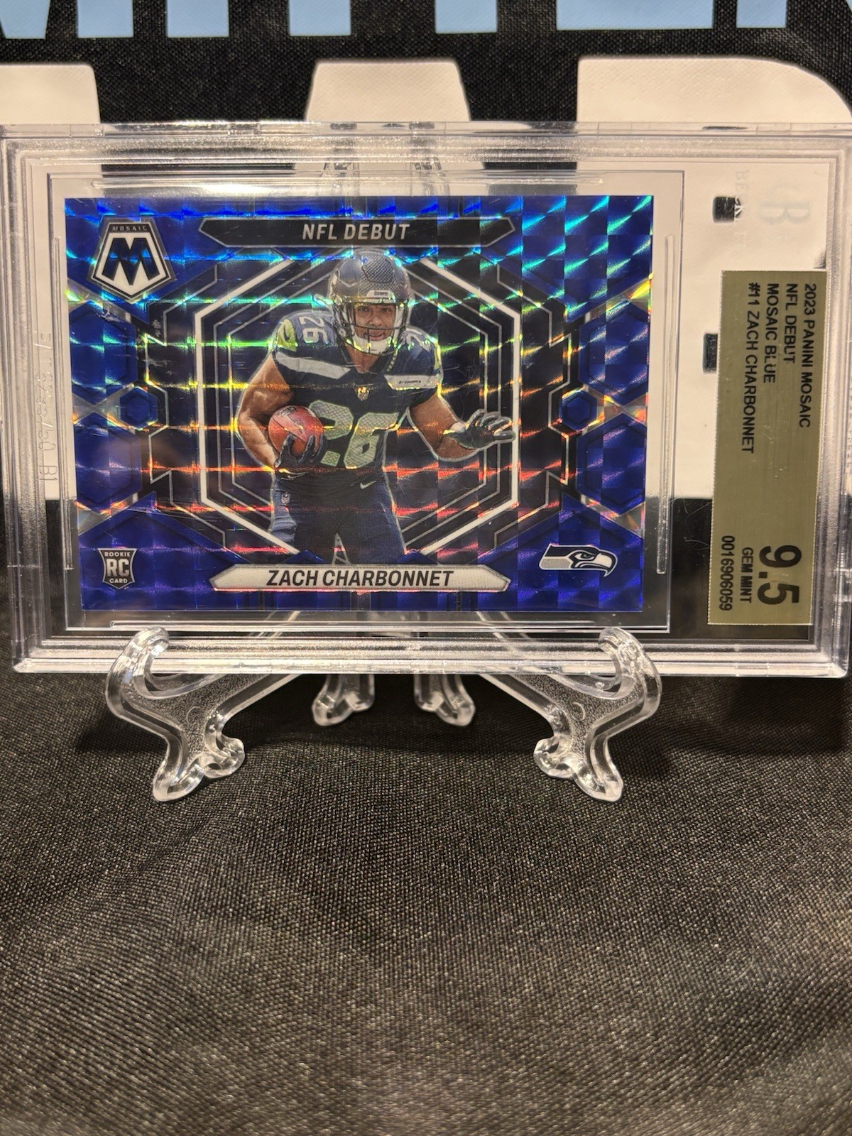 2023 Panini Mosaic NFL Debut Zach Charbonnet #ND-11 Blue Mosaic Prizm /99 (RC)