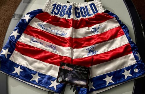 RARE 1984 USA GOLD BOXING TRUNKS SIGNED BY WHITAKER, BIGGS, BRELAND & TAYLOR