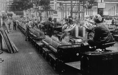 Production line shells being conveyed via an overhead trolley a wo Old Photo