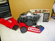 Canon AE-1 Film Camera & 50 1.8 Lens, Cannon Power Winder, Cannon Strap, Manuals