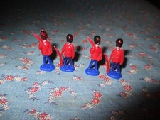 Four Mini Plastic Soldiers Palace Guards 1 1/8" High Red Blue
