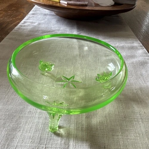 vintage 3-footed green depression glass bowl is made of uranium glass