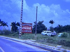 2 Vintage 1969 COCA COLA Advertising Sign French Bon Voyage Palm Trees Junk Cars