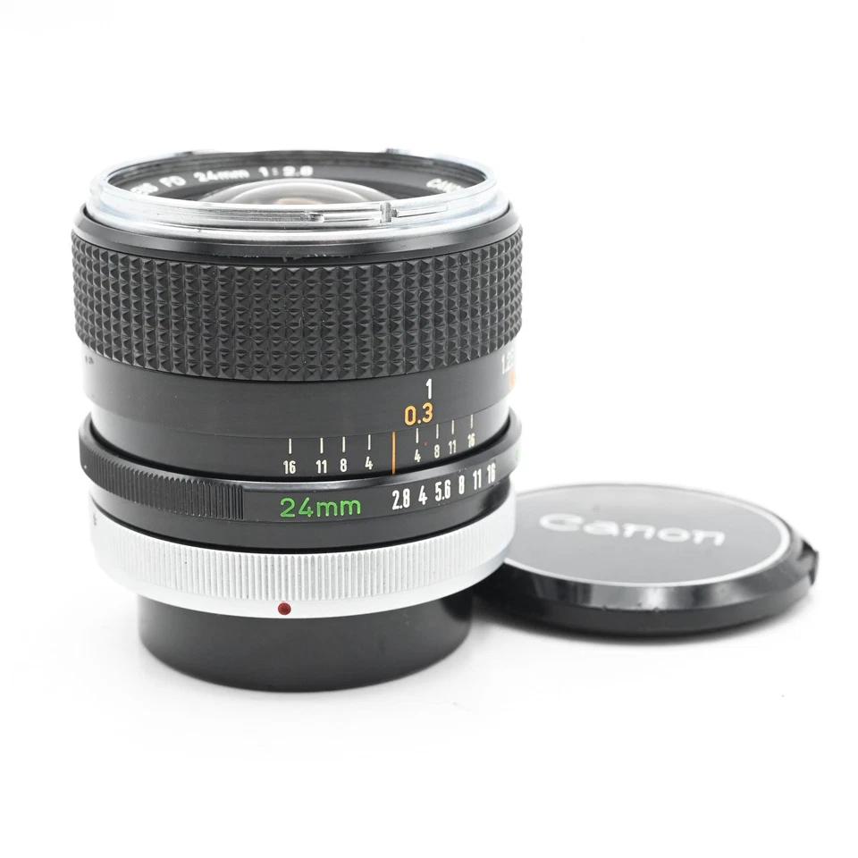 Lente Canon 24 mm f2,8 FD BL nariz cromada temprana, marca "O" #970