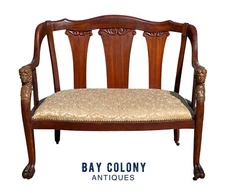 ANTIQUE ART NOUVEAU MAHOGANY SETTEE WITH FIGURAL CARVINGS ATTRIBUTED RJ HORNER