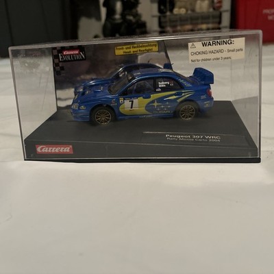 CARRERA EVOLUTION 1/32 SUBARU IMPREZA N° 7.Glass box name doesn t match car.