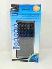 THE SHARPER IMAGE UNIVERSAL JUMBO REMOTE W/ LUMINESCENT TOUCH PAD LIGHTED BUTTON