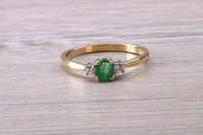 Dainty Emerald and Diamond set Yellow Gold Trilogy Ring