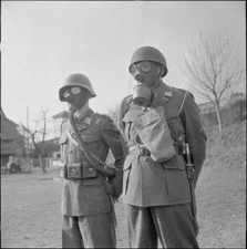 Swiss soldiers in gas masks and helmets in 1958 Old Historic Photo