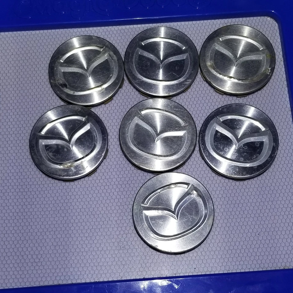Lote de 7 Tapacubos Mazda 626 Protege Millenia Tapacubos Mecanizados 2.25" Fabricante de Equipo Original Foto 2 de 4