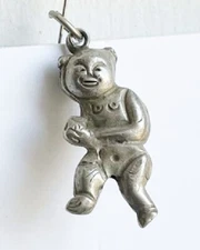 Antique Chinese Silver Repousse Running Baby Pendant