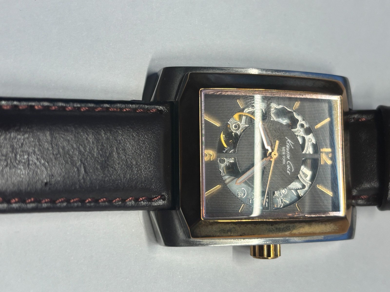 The Kenneth Cole New York Men's Watch KC1454 is a rectangular automatic skeleton