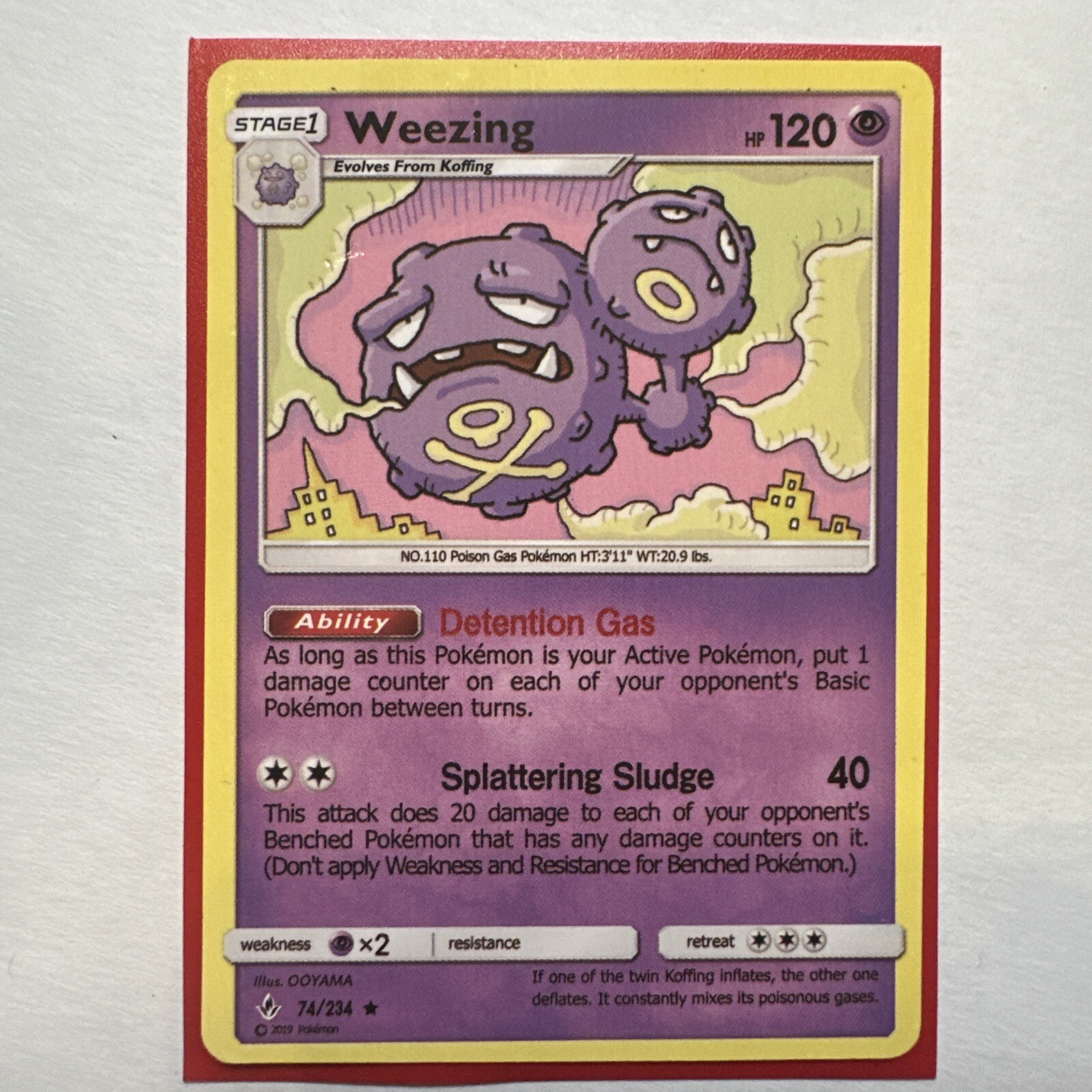 Weezing 74/214 Pokemon Card Unbroken Bonds in Card Protector
