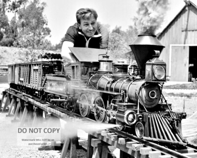 WALT DISNEY WORKING ON HIS MODEL RAILROAD TRAIN - 8X10 PHOTO (BB-634)