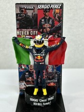 Figure 1/43 Sergio Perez Oracle Red Bull Formula 1 with Flag + Podium