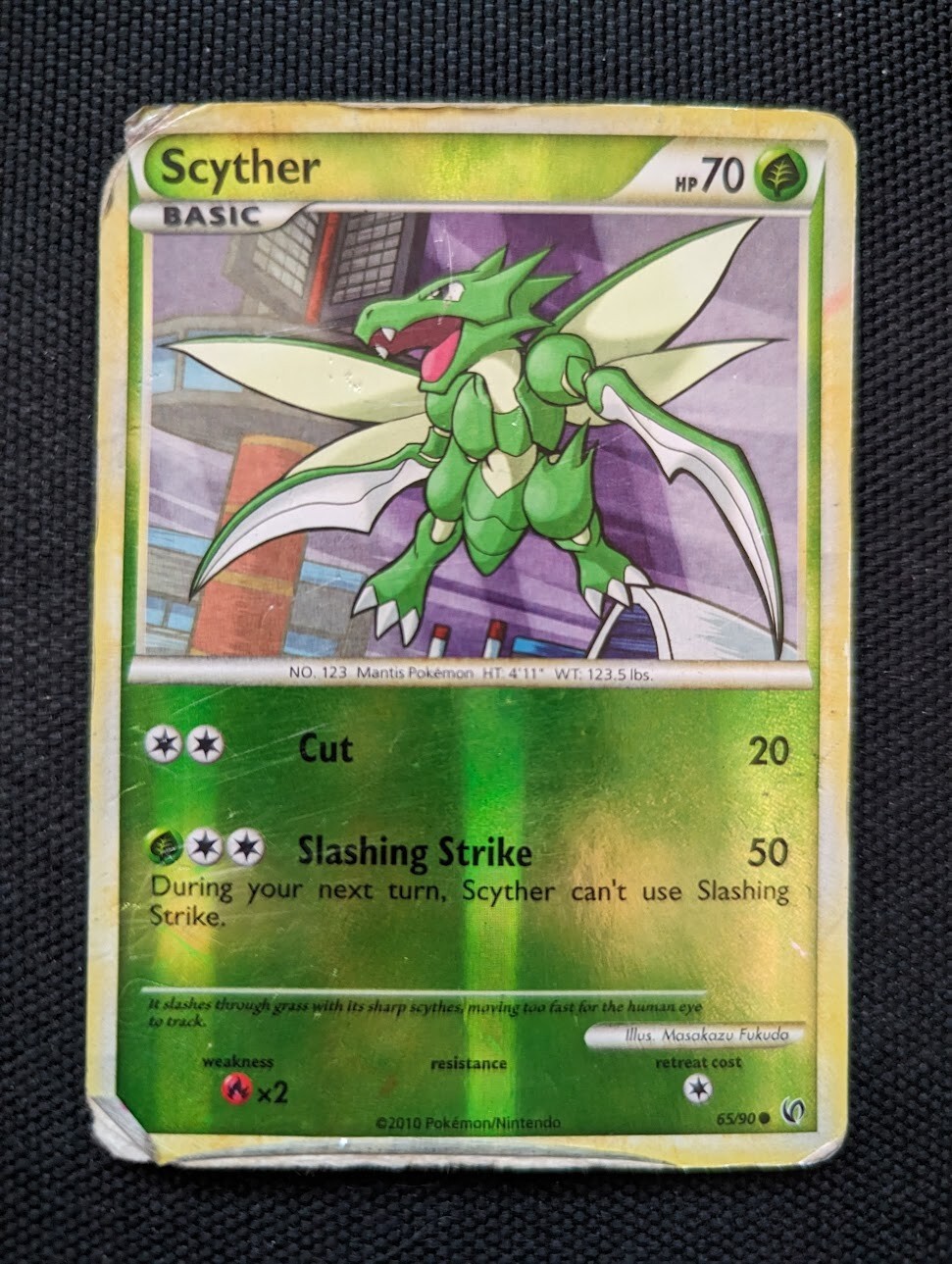 Scyther 65/90 Undaunted Reverse Holo Pokemon Card - DMG