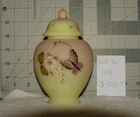 Fenton Burmese flowers with butterfly 6in jar with chipped piece on lid