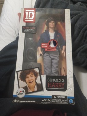 The product in the image is a One Direction Singing Harry doll. This 12-inch
