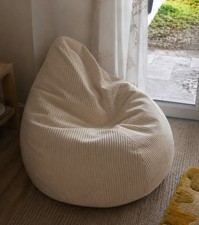 large bean bag chair with filling. Cream. Good condition.