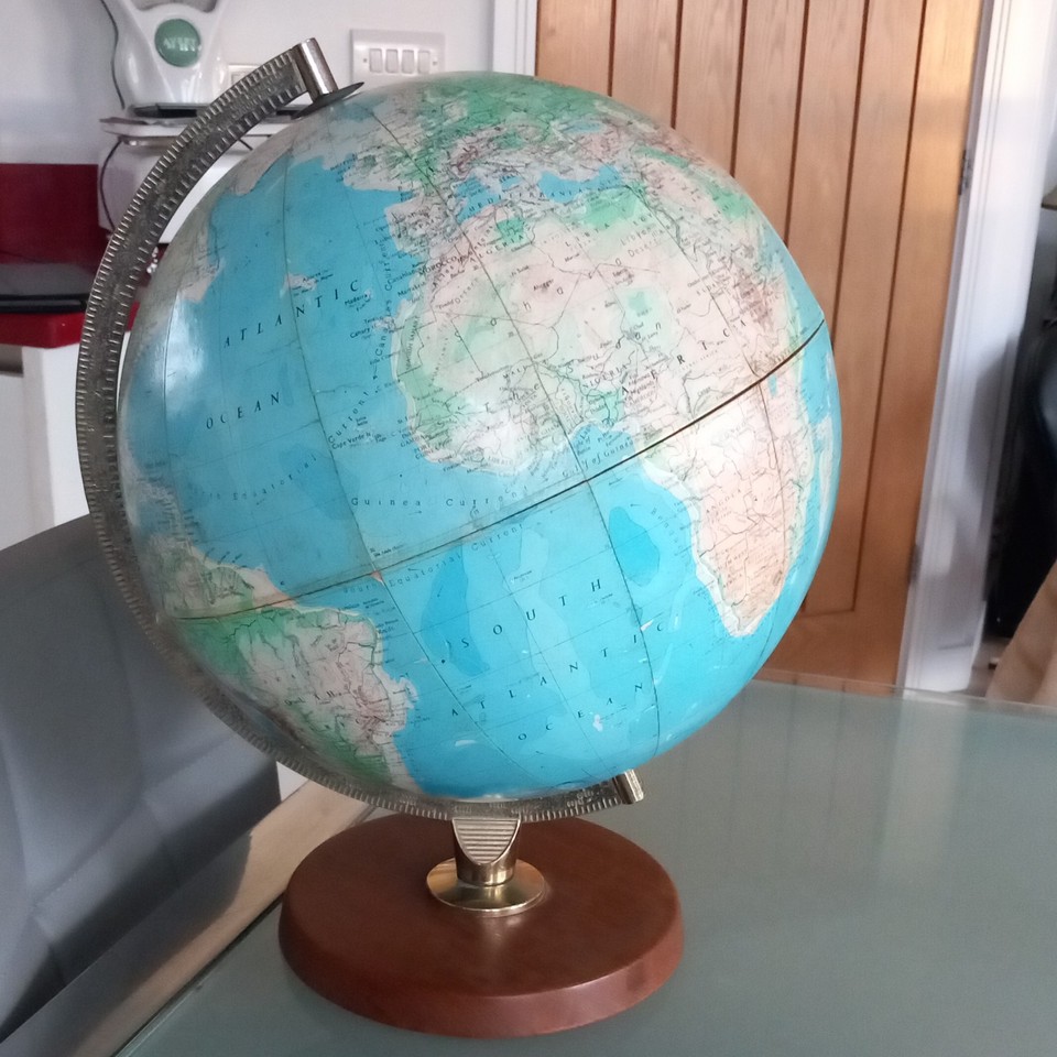 1969 Philips globe on a warm teak base — mid-century design perfection that looks like it belongs in a Danish architect's study.