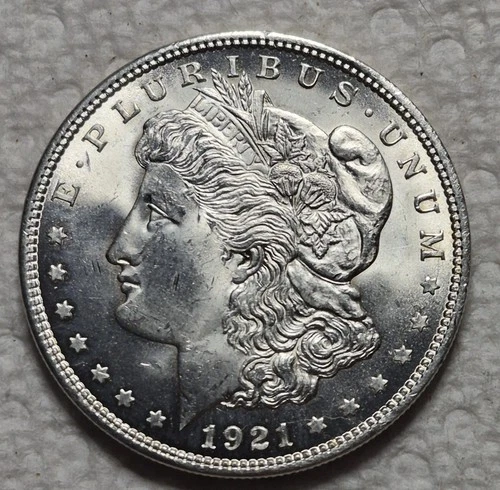 1921 P Morgan Silver Dollar. Estimated Uncirculated Mint State 64. Video M0089.
