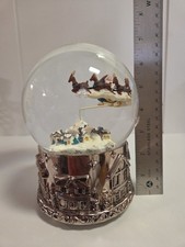 Wallace silversmith Santa in flight musical snow globe with silver plated base